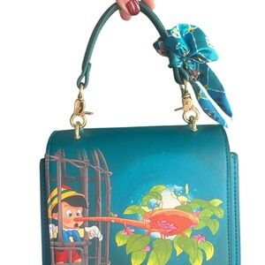 Disney Loungefly Pinocchio Mini Top Handle Crossbody Bag – Teal